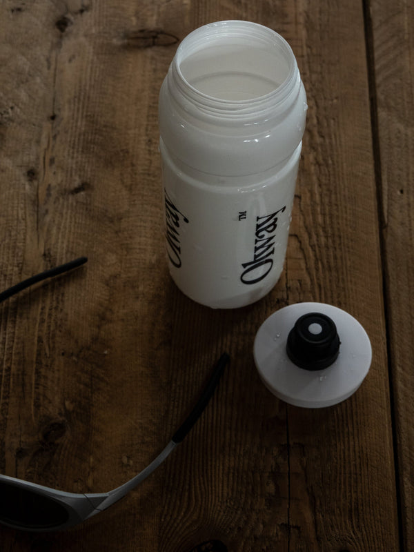 Olway Hydration Bottle 750ml open on a wooden table with the cap off